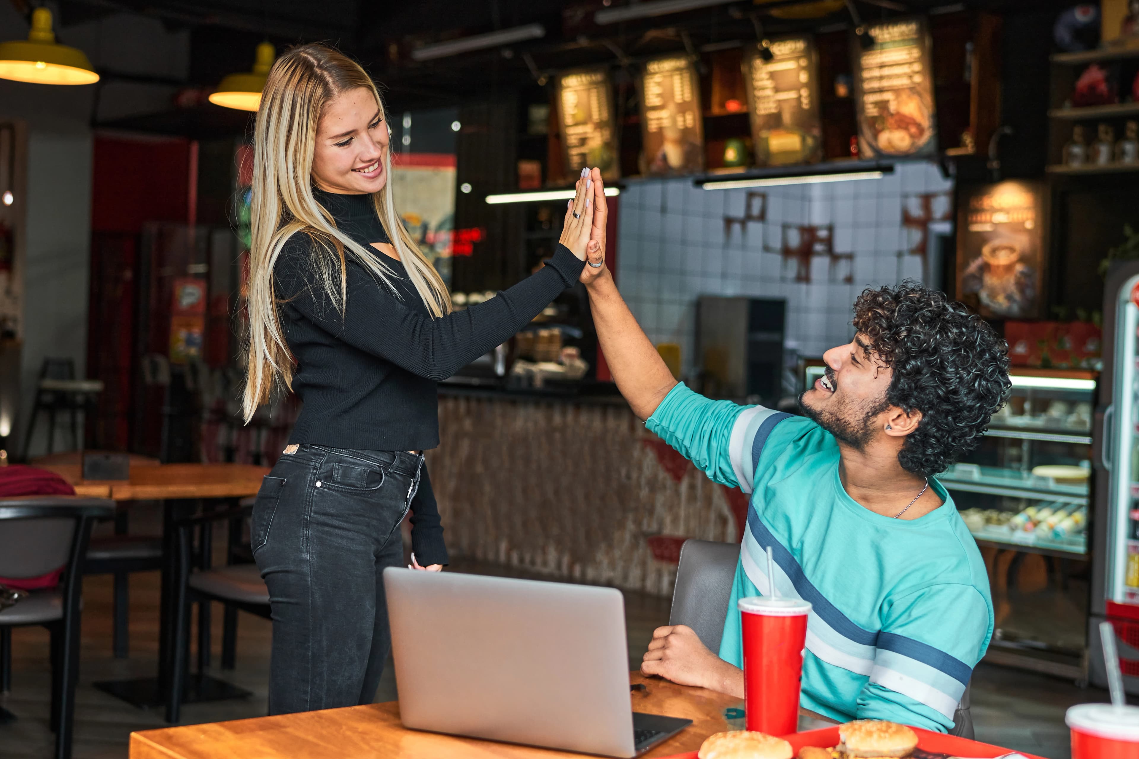 Restaurant owners celebrating the launch of their website.